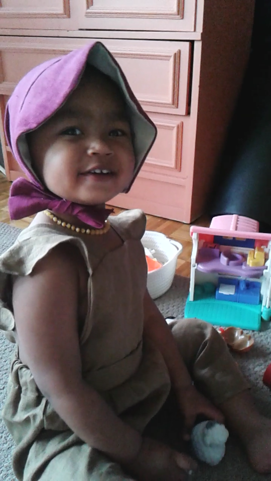 Francine Levesque sews her own clothes for her daughter Nyah, 2.