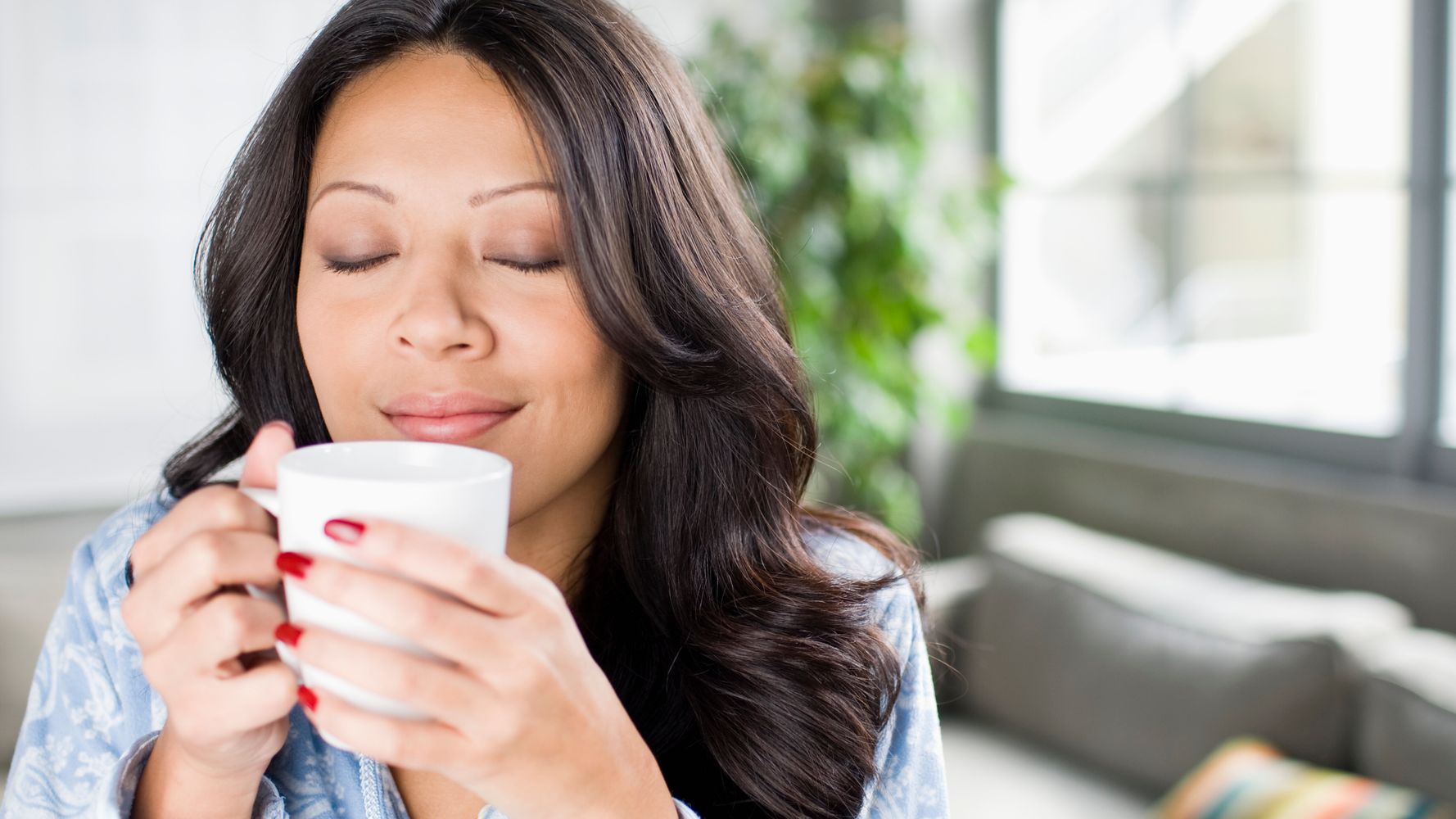 Coffee smell. A person smelling the Air. Woman smell Cocking Shutterstock.