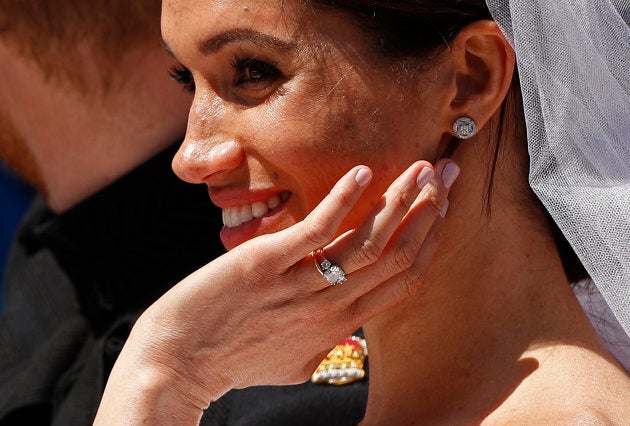 Prince Harry and Meghan Markle ride in an Ascot Landau after their wedding ceremony at St. George's Chapel in Windsor Castle.