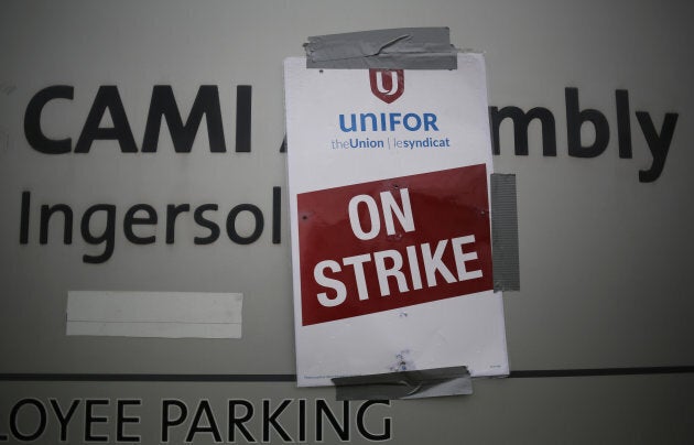 A strike poster from the auto workers union Unifor is posted at a picket line outside the General Motors Co CAMI assembly plant in Ingersoll, Ont., on Oct. 13, 2017.