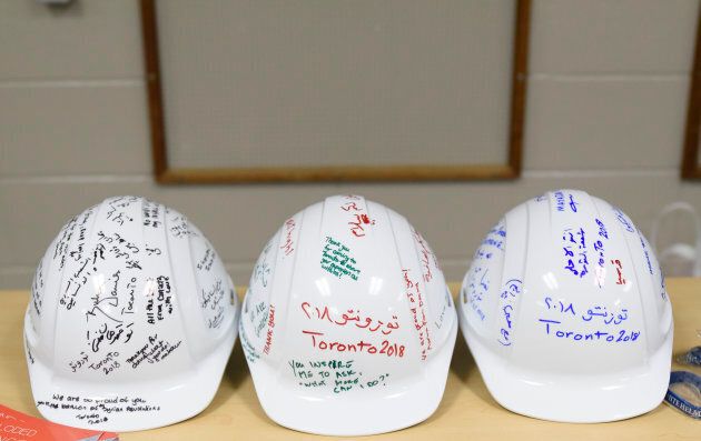 Messages written on while helmets by the audience during a moderated discussion and audience Q&A with The White Helmets in Toronto on April 3, 2018.