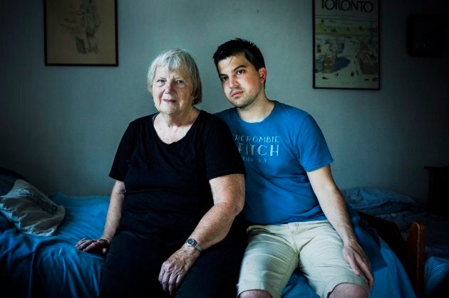 Elizabeth Hill poses for a portrait with her live-in student Julio Hernandez, in her home in Toronto, on July 20, 2018.