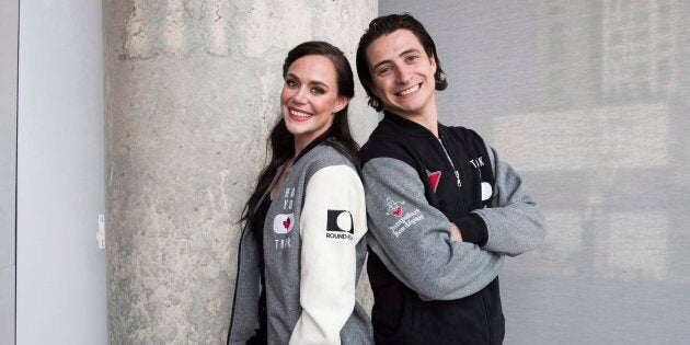 Ice dancing pair Tessa Virtue and Scott Moir pose for a photo at the Entertainment One office in Toronto, Tues. July, 10, 2018.