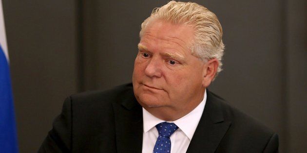 Ontario Premier Doug Ford looks on during an intergovernmental meeting at Toronto City Hall on July 23, 2018, after a mass shooting in the city.