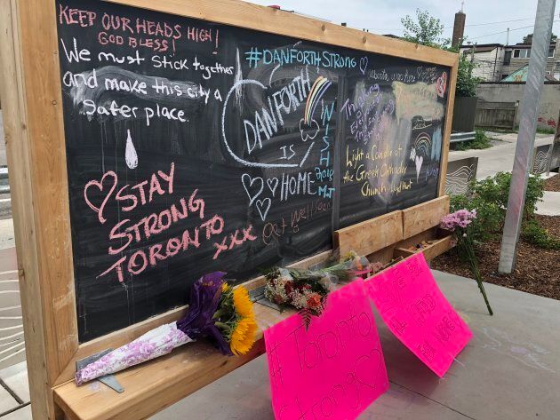 People have left messages on a chalkboard in a parkette in Toronto's Greektown.