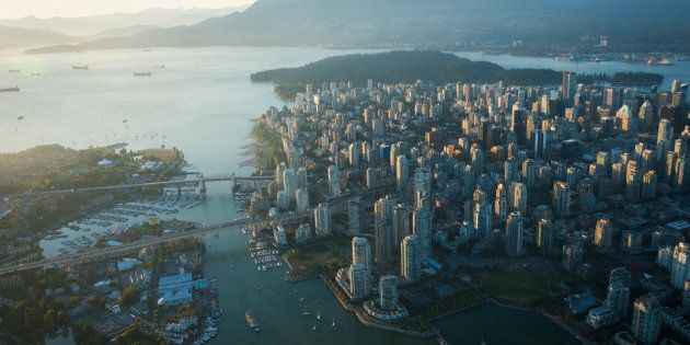 An aerial image of Vancouver, showing Stanley Park, downtown, Granville Bridge, Burrard Street Bridge and the waterfront.