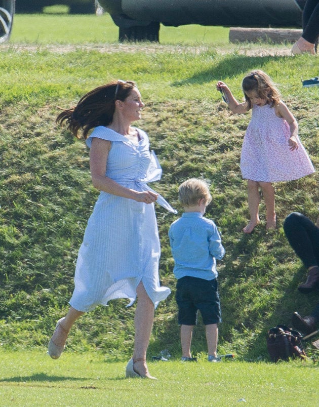 Catherine, Duchess of Cambridge, chasing after Prince George and Princess Charlotte during the Maserati Royal Charity Polo Trophy at Beaufort Park on June 10, 2018 (less than two months after giving birth to Prince Louis) in Gloucester, England.