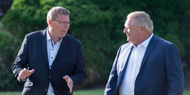 Saskatchewan Premier Scott Moe and Ontario Premier Doug Ford walk to a reception as the Canadian premiers meet in St. Andrews, N.B., on July 18, 2018.