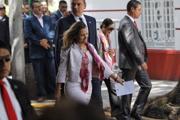 Canadian Foreign Minister Chrystia Freeland, centre, and her delegation leave a private meeting with Mexican President-elect Andres Manuel Lopez Obrador at his office, in Mexico City, Mexico, on July 25, 2018.