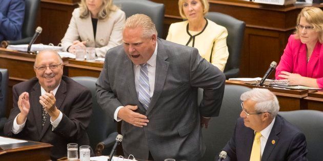 Ontario Premier Doug Ford takes a bow after bragging about his election victory during question period at the Ontario Legislature in Toronto on July 30, 2018.