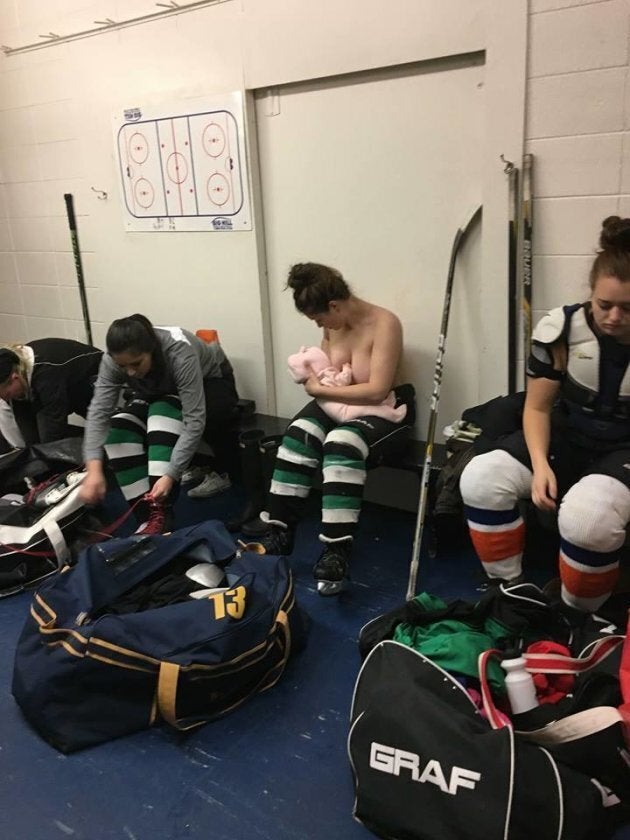 Serah Small breastfeeds her daughter in her hockey locker room.