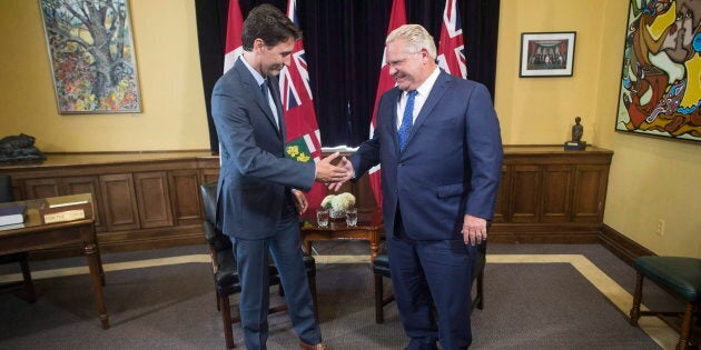 Ontario Premier Doug Ford and Prime Minister Justin Trudeau pose for a photo at the Ontario legislature in Toronto on July 5, 2018.