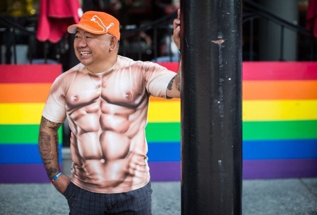 Raffi Rumbaua laughs while waiting for the Pride Parade to begin in Vancouver, on Aug. 2018.