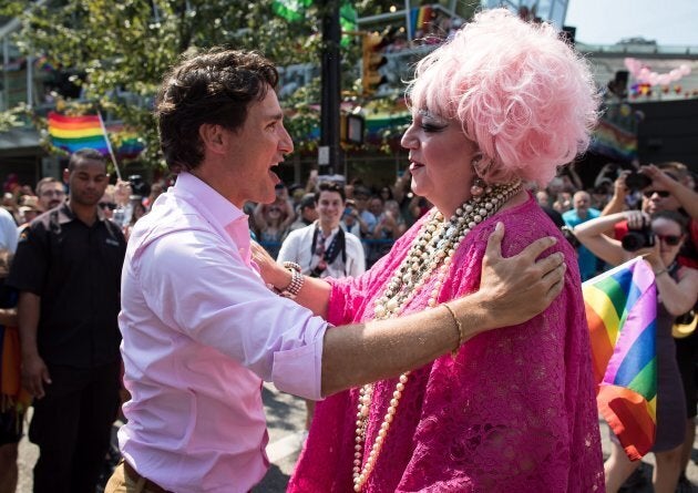 Justin Trudeau, embraces Conni Smudge while marching in the Pride Parade in Vancouver, on Aug. 5, 2018.