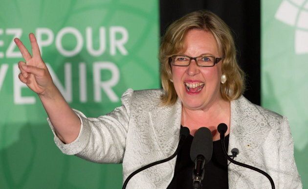Green Party leader Elizabeth May gives the victory sign as she speaks to supporters after being elected MP for Saanich-Gulf Islands in Sidney, B.C., on May 2, 2011.
