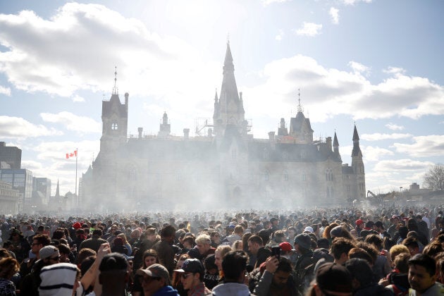 Smoke rises during the annual 4/20 marijuana rally on Parliament Hill in Ottawa on April 20, 2018.