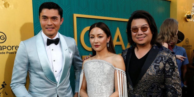 Author Kevin Kwan (R) and cast members Henry Golding and Constance Wu pose at the