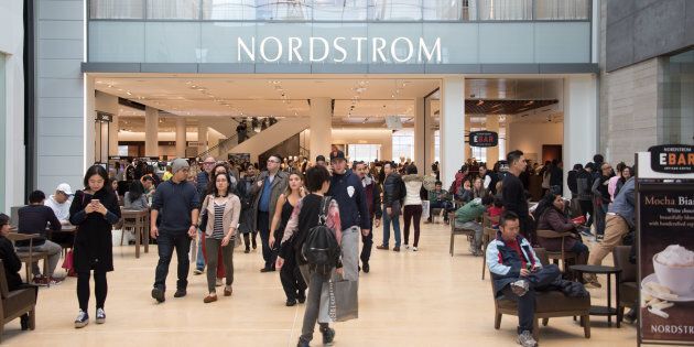 Shoppers at Yorkdale Shopping Centre in Toronto, with a Nordstrom location visible in the background. Fears of job losses following Ontario's minimum wage hike have not come to fruition.