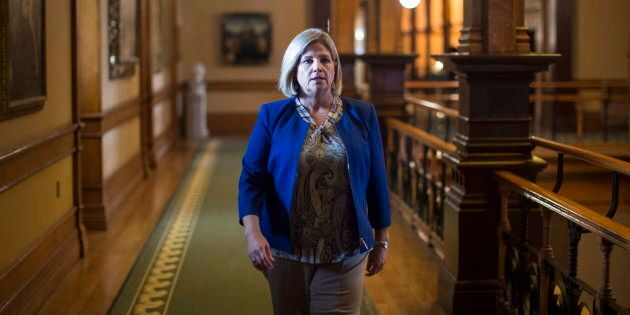 NDP Leader Andrea Horwath walks to her office following question period at the Ontario Legislature in Toronto on Aug. 1, 2018.