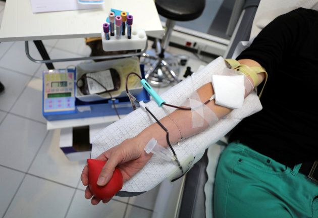 A volunteer donates blood during France's international blood donation day in Nice on June 14, 2018.