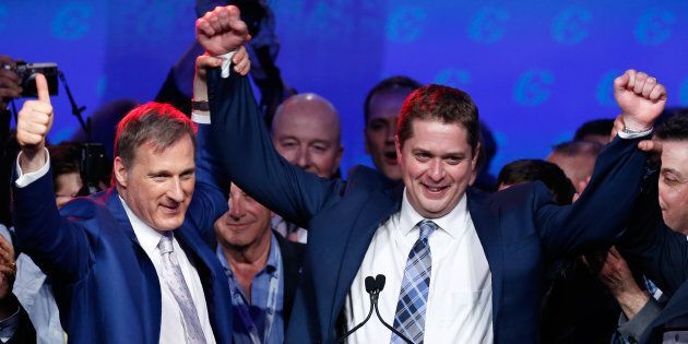 Maxime Bernier celebrates with Andrew Scheer after Scheer's Conservative Party of Canada leadership convention win in Toronto on May 27, 2017.