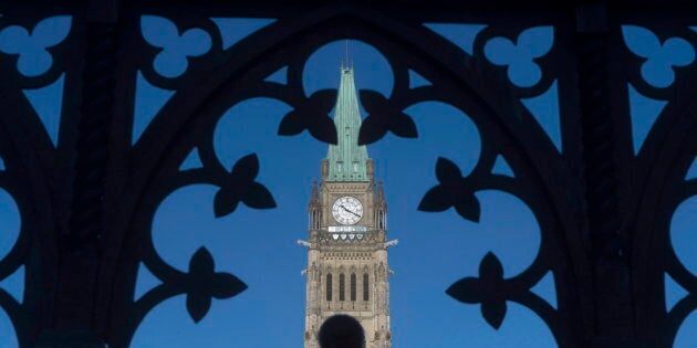 The Peace Tower is framed through a gate on Parliament Hill in Ottawa on Jan. 21, 2016.