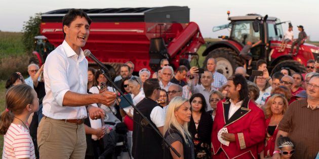 Prime Minister Justin Trudeau addresses local Liberals and Liberal MPs from the South Shore of Montreal for a summer corn roast in Sabrevois, Que., on Aug. 16, 2018.