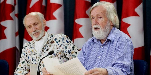 Gilles Provost, left, listens as President of the Canadian Coalition for Nuclear Responsibility Gordon Edwards speaks during a news conference in Ottawa on Aug. 21, 2018.