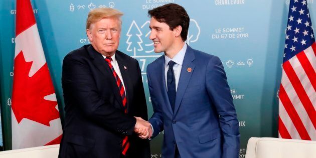 U.S. President Donald Trump shakes hands with Prime Minister Justin Trudeau at the G7 Summit, June 8, 2018.