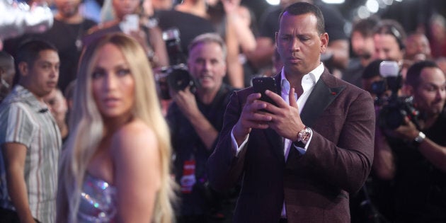 Alex Rodriguez proudly photographs girlfriend Jennifer Lopez at the 2018 MTV VMAs on Aug. 20, 2018.