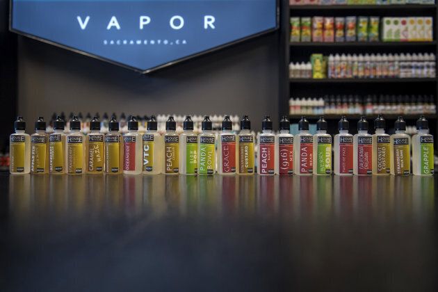 Bottles of flavored vape juice for electronic cigarettes are displayed for sale at the NXNW Vapor store in Sacramento, California.
