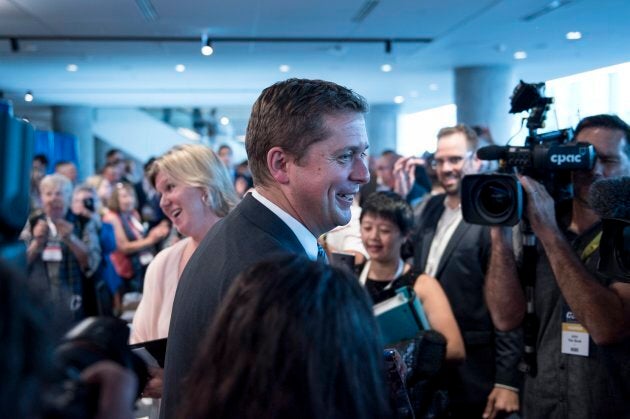 Conservative leader Andrew Scheer is greeted by supporters at the Party's national convention in Halifax on Aug. 23, 2018.