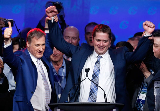 Maxime Bernier celebrates with Andrew Scheer after Scheer's leadership win during the Conservative Party of Canada leadership convention in Toronto on May 27, 2017.