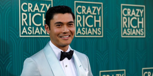 Actor Henry Golding poses at the Los Angeles premiere for