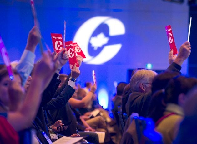 Delegates vote on party constitution items at the Conservative Party of Canada national policy convention in Halifax on Friday.