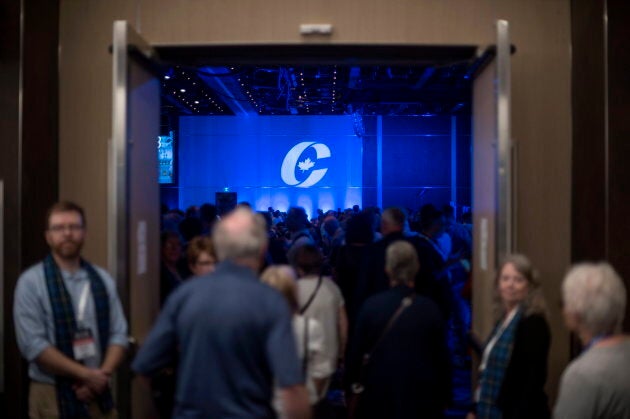 Supporters enter the auditorium for the opening ceremony at the Conservative national convention in Halifax on Aug. 23, 2018.