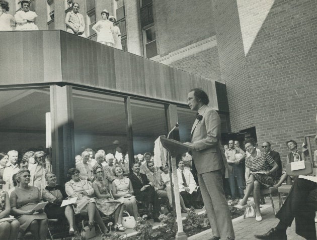 While demonstrators shouted from across the street, almost drowning out his address with their demands for free abortions; Prime Minister Pierre Trudeau draws laughter from his audience at the opening of a new $16 million wing at Women's College Hospital in Toronto on June 23, 1971.