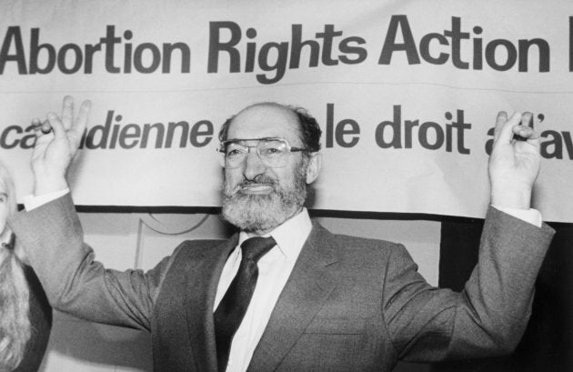 Dr. Henry Morgentaler raises his arms in victory at a news conference in Toronto, Ont., Jan. 28, 1988.