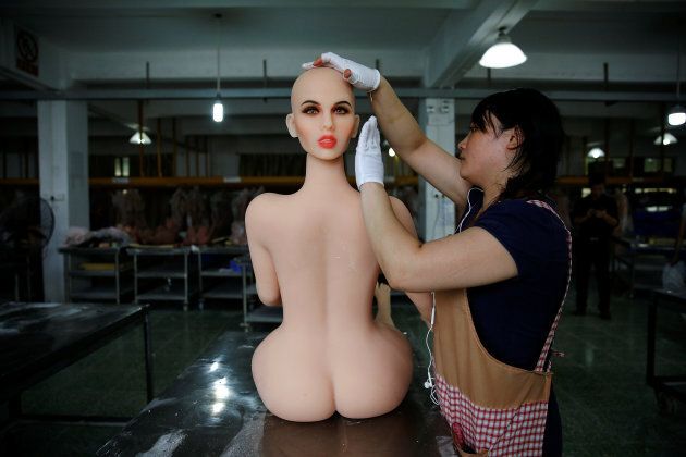 A worker assembles a sex doll at the WMDOLL factory in Guangdong, China, on July 11, 2018.