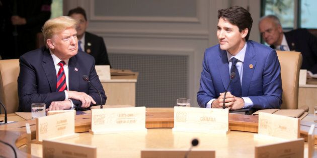 U.S. President Donald Trump and Prime Minister Justin Trudeau participate in the working session at the G7 Summit in La Malbaie, Que. on June 8, 2018.