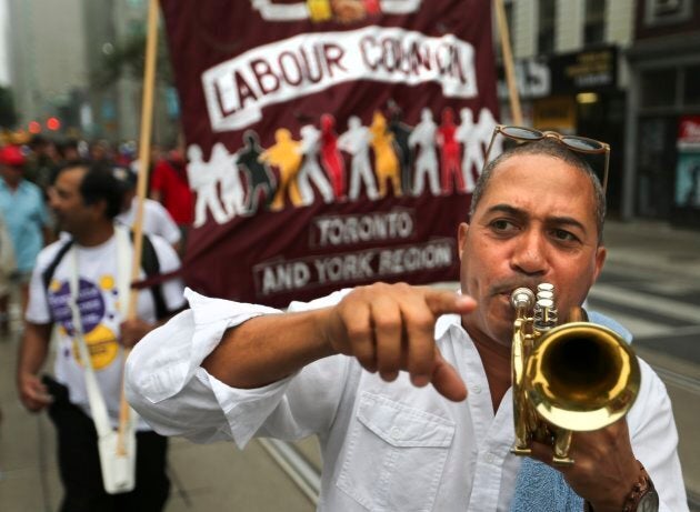 A demonstrator marching at the Annual Labour Day parade in Toronto on Sept. 1, 2014.