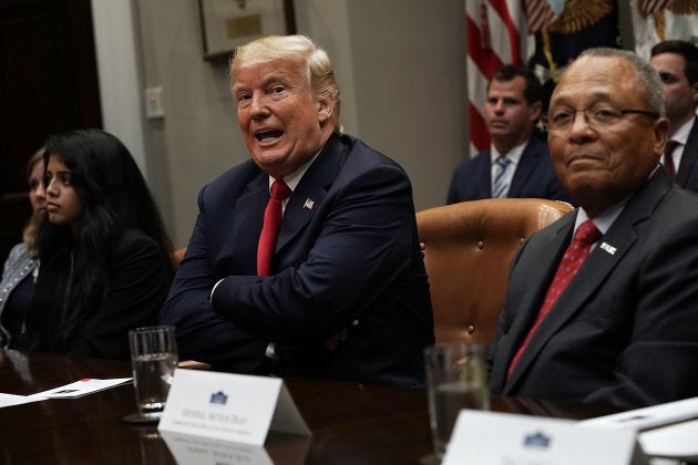 U.S. President Donald Trump listens during a meeting in the Roosevelt Room of the White House on Aug. 29, 2018.