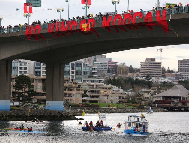 Protesters against the proposed expansion of the Trans Mountain pipeline cross a bridge in Vancouver on Nov. 19, 2016.