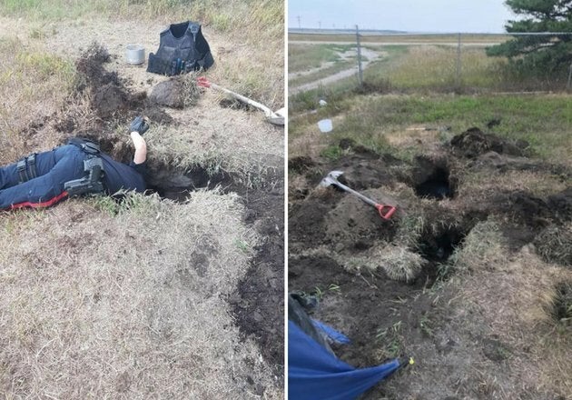 An officer digs deep within a network of tunnels to rescue the three-week-old pups.