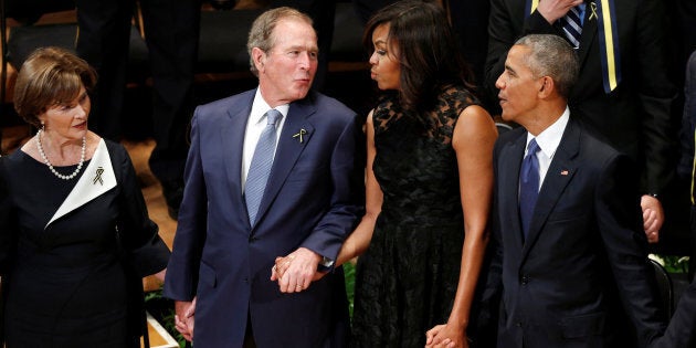 Former President George W. Bush and former first lady Michelle Obama have what appears to be a genuine bond, sharing several heartwarming moments at recent public events. Here they join hands during a memorial service in Dallas, Texas on July 12, 2016.