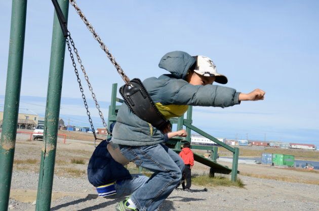 Inuit schoolchildren speak in English to each other on the playground at Leo Ussak Elementary School, Rankin Inlet.