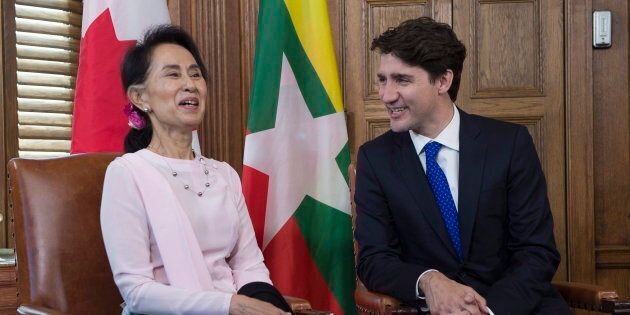 Aung San Suu Kyi, the civilian leader of Myanmar and an honorary Canadian citizen, shares a laugh with Canadian Prime Minister Justin Trudeau in his office on Parliament Hill in Ottawa on June 7, 2017.