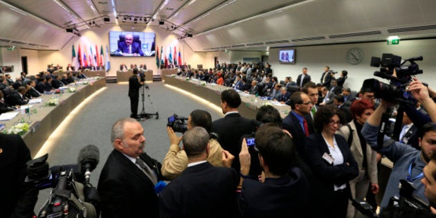 Members of the media cover the 164th OPEC (Organization of the Petroleum Exporting Countries) meeting in Vienna, on December 4, 2013. OPEC is set to stick to its oil output limit at a meeting here, even as Iraq and Iran eye higher crude exports amid slashed Libyan production. AFP PHOTO / ALEXANDER KLEIN (Photo credit should read ALEXANDER KLEIN/AFP/Getty Images)