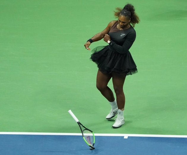 Serena Williams smashes her racket during the U.S. Open.