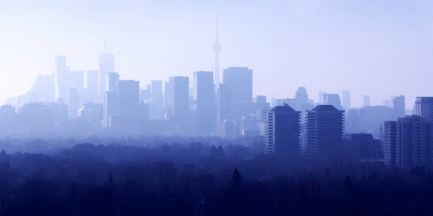 Midtown Toronto on a foggy morning, with downtown in the background. A recent poll found that half of Torontonians are hoping for house prices to fall, but a new report from Royal Bank of Canada basically says